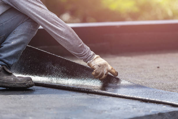 Professional Basement Waterproofing technician working in Rosaryville, MD